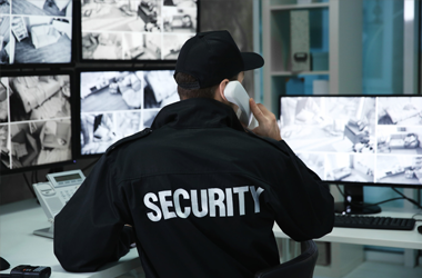  A guard watching CCTV footage