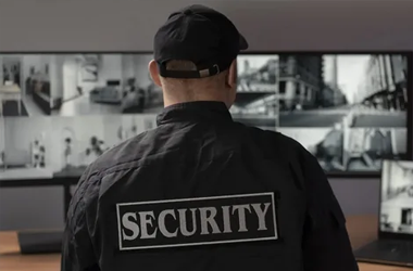 A security personnel member watching a screen